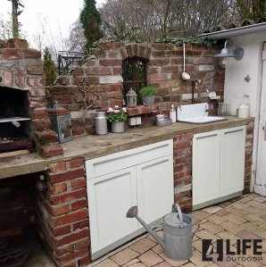DIY brick frame around modular stainless steel cabinets